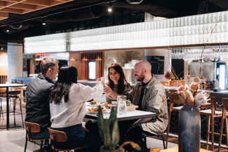 A group of friends dining in Hafnartorg in Reykjavík